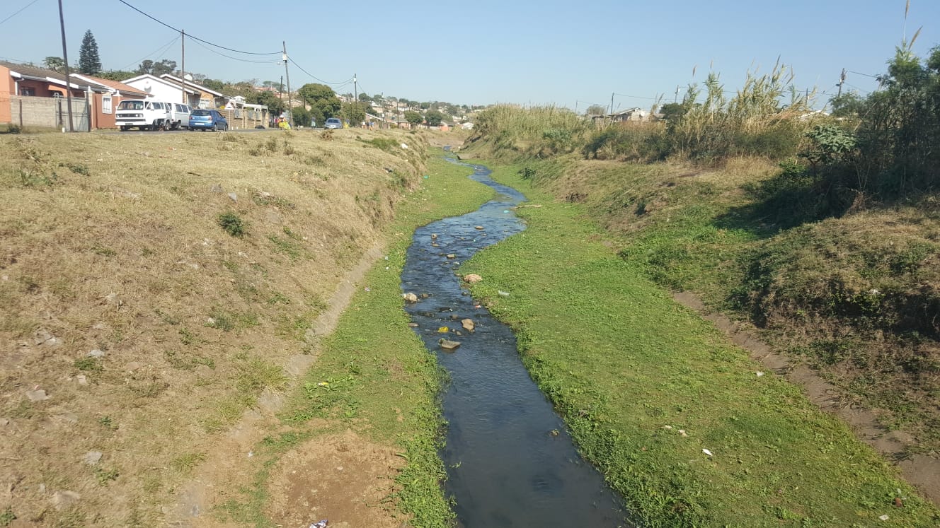 Stream flowing in a residential area