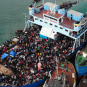Haitian citizens crowding on a ship