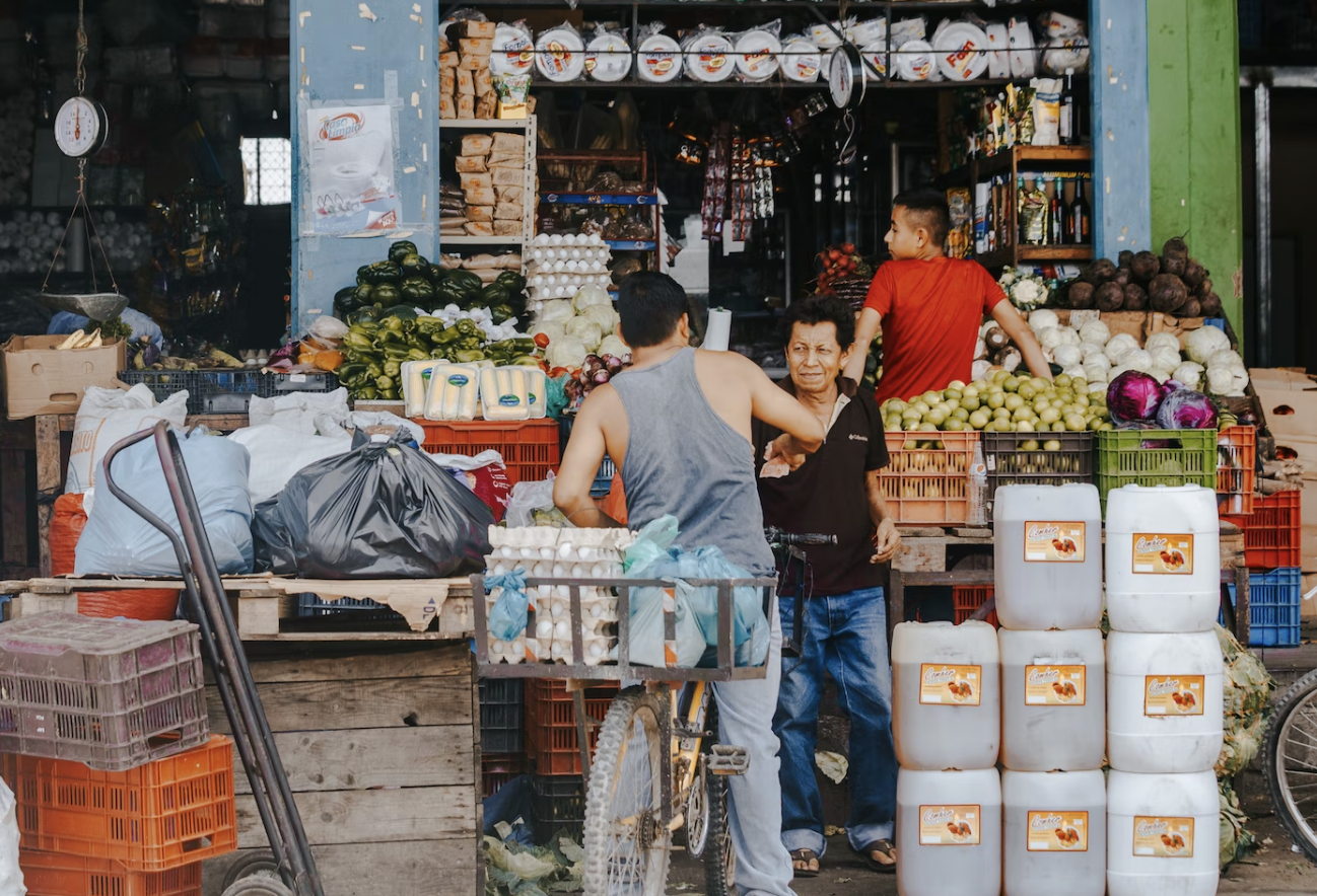 People buying from a market stall in Honduras